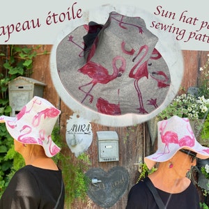 May include: A sun hat sewing pattern featuring a pink flamingo print. The pattern is called "Chapeau étoile" and is available as a PDF download. The image shows two women wearing the hat, one in a garden setting and the other in front of a wooden door.
