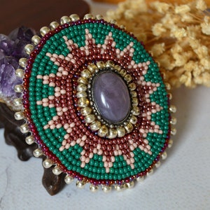 Southwestern style beaded brooch, Green and red bead embroidered medallion 2.3 inches