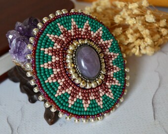 Southwestern style beaded brooch, Green and red bead embroidered medallion 2.3 inches