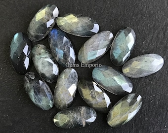 Cabochon ovali taglio rosa in labradorite naturale da 14 x 7 mm. Buona qualità. Prezzo al pezzo.