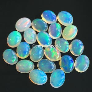 Natural Ethiopian Opal, 8x6 mm Oval Cabochons. Excellent Quality Material with Amazing play of colors. Priced Individually