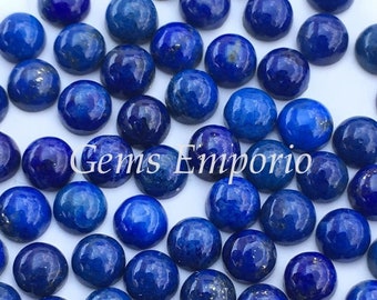May include: A collection of 50 round, blue lapis lazuli cabochons with gold flecks. The cabochons are approximately 6mm in diameter.