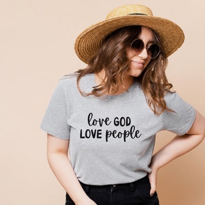 神を愛し、人を愛する - ベラ キャンバス Tシャツ