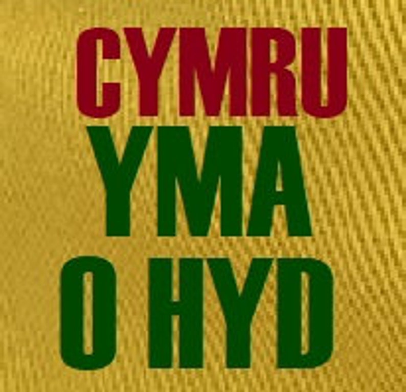 May include: A gold background with the words "CYMRU YMA O HYD" in red and green lettering.