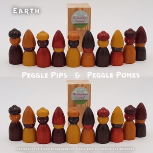 May include: A set of wooden peg dolls with different coloured hats and clothing. The dolls are arranged in two rows, with the top row labelled "EARTH" and the bottom row labelled "PEGGLE PIPS & PEGGLE POMES".