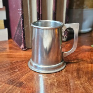 Stiff Silver Pewter Mini Mug. In great condition. Polished and ready to use. Ships FREE in USA