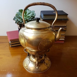 Antique Handmade Brass & Copper teapot on stand. Good Condition. Tin lined. No leaks. Repoussé Lotus, Crane, Butterflies. Ships FREE in USA.