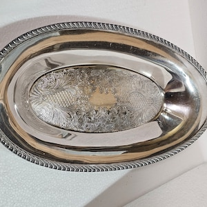 Oval Silver Dish. Oblong shape with flowers and stylized pineapples. Versatile uses. Polished and ready to use. Ships FREE in the USA