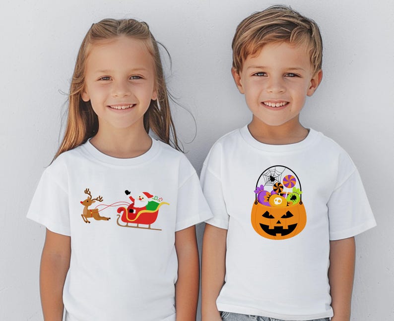 May include: Two children wearing white t-shirts with holiday-themed designs. The girl's shirt features a cartoon Santa Claus riding in a sleigh pulled by a reindeer. The boy's shirt features a cartoon pumpkin filled with candy and a spider web.