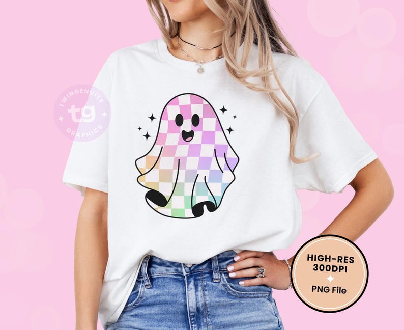 The rainbow ghost is on a white t-shirt mockup against a light pink background.