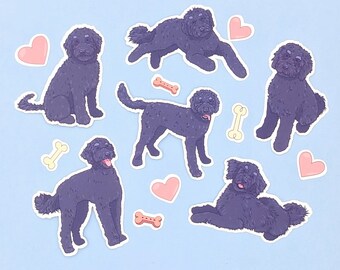 May include: A set of nine stickers featuring black doodle-style illustrations of dogs with hearts and bones. The stickers are on a light blue background.