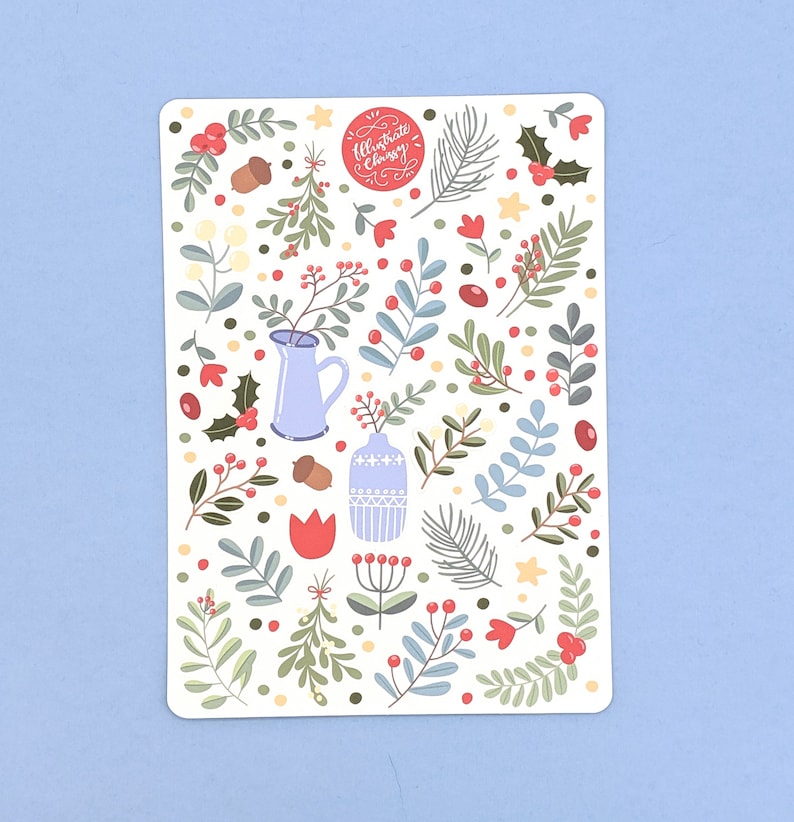 May include: A white background with a repeating pattern of blue and green leaves, red berries, and small white flowers. The text "Illustrate Christmas" is in a red circle at the top of the image.