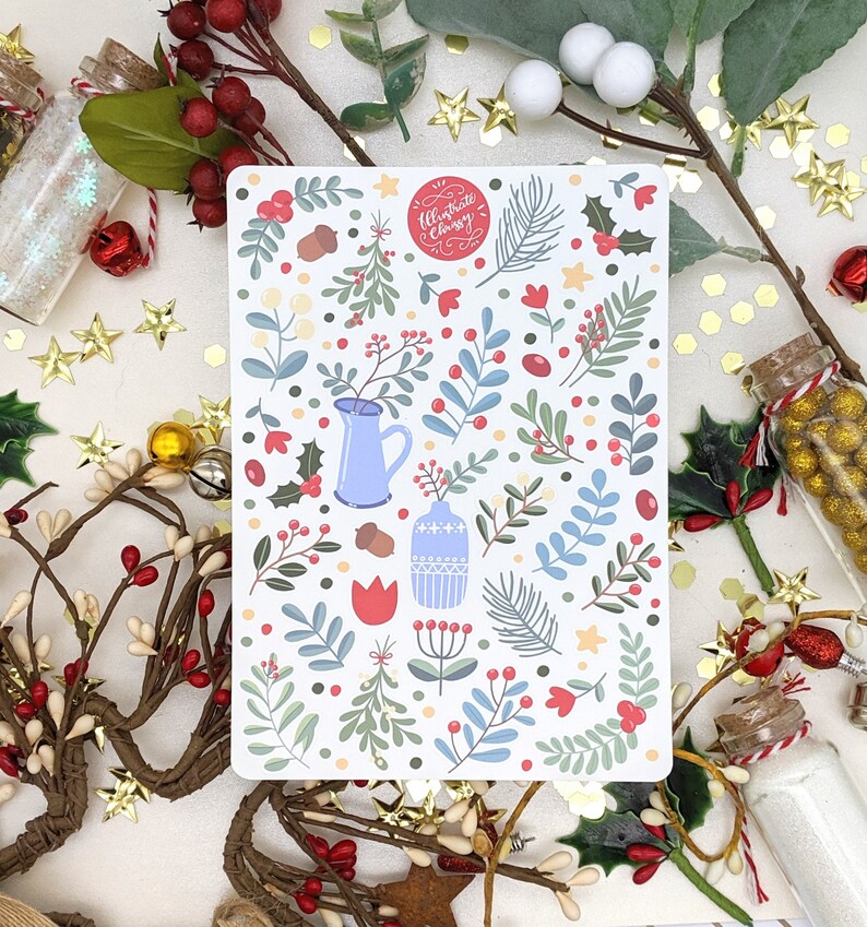 May include: A white card with a red circle that says "Illustrate Classy" and a pattern of blue, green, and red floral designs. The card is surrounded by gold stars, red berries, and green leaves.