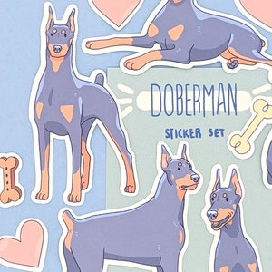 May include: A sticker set featuring Doberman Pinschers in various poses. The stickers are in a cartoon style with a light blue and pink color scheme. The set includes a bone, hearts, and the text "Doberman Sticker Set".