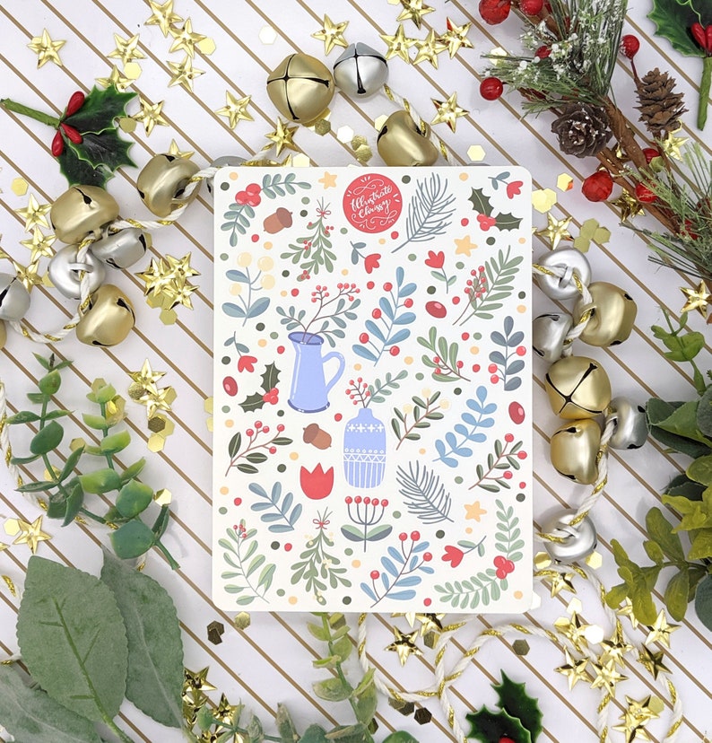 May include: A white card with a floral pattern and a red circle with the text "Celebrate Every Day" in white. The card is surrounded by gold and silver bells and red berries.