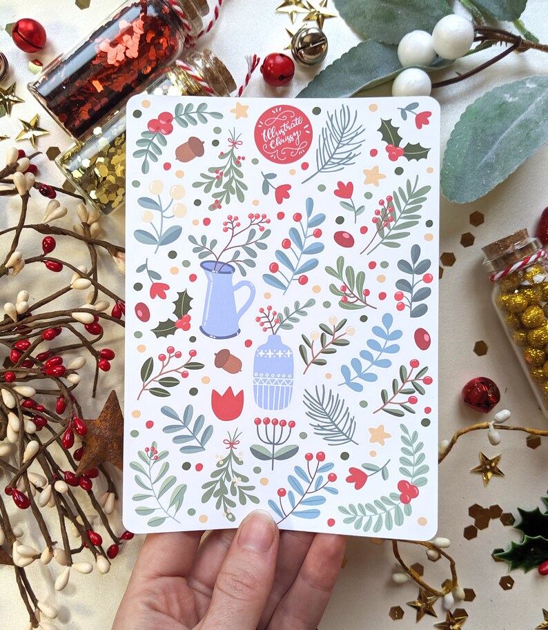 May include: A white card with a red circle that says "Ultimate Christmas" and a pattern of blue and green leaves, red berries, and white flowers. There are also blue and white vases and red tulips.