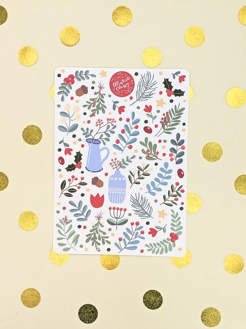 May include: A white sticker sheet with a Christmas-themed design. The design features a variety of green and blue leaves, red berries, and other festive elements. The sticker sheet also includes a red stamp with the text "Illustrate Classy".