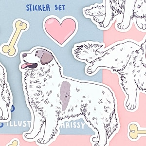 May include: A sticker set featuring Great Pyrenees dogs. The set includes a heart, bones, and two different poses of the dog. The text "Great Pyrenees Sticker Set" is at the top of the image.