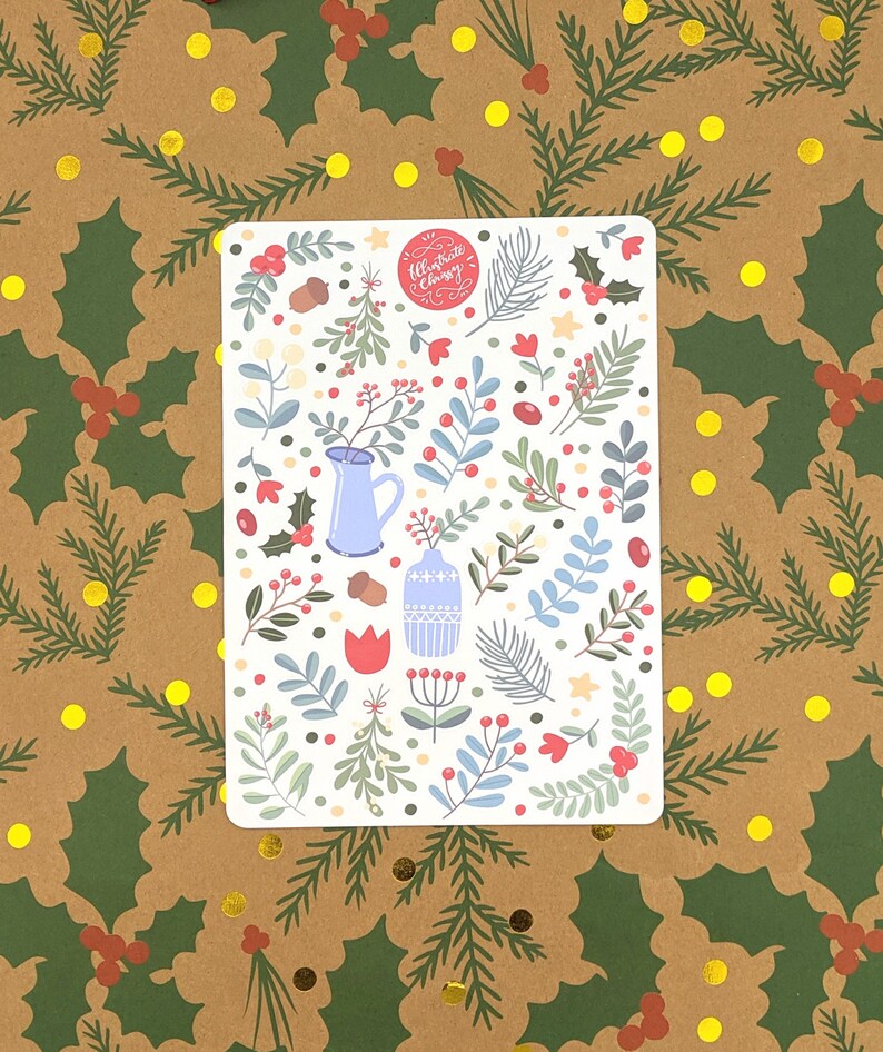 May include: A white sticker sheet with a festive Christmas design. The sticker sheet features a variety of illustrations including red berries, green leaves, blue vases, and a red tulip. The text "Celebrate Christmas" is written in red cursive on a red circle.