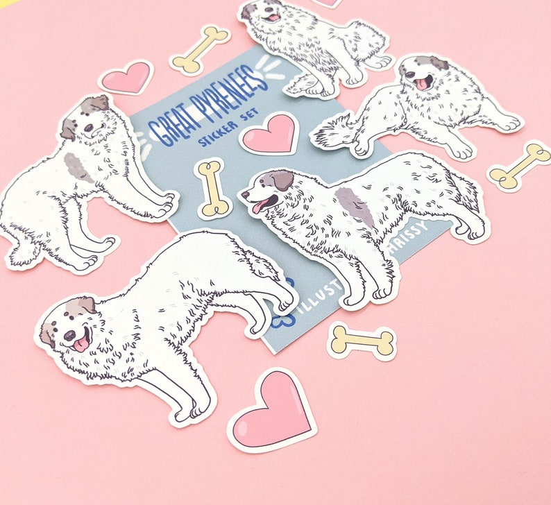 May include: A set of Great Pyrenees dog stickers with hearts and bones. The stickers are white with black markings and have a cartoon style. The stickers are on a pink background.