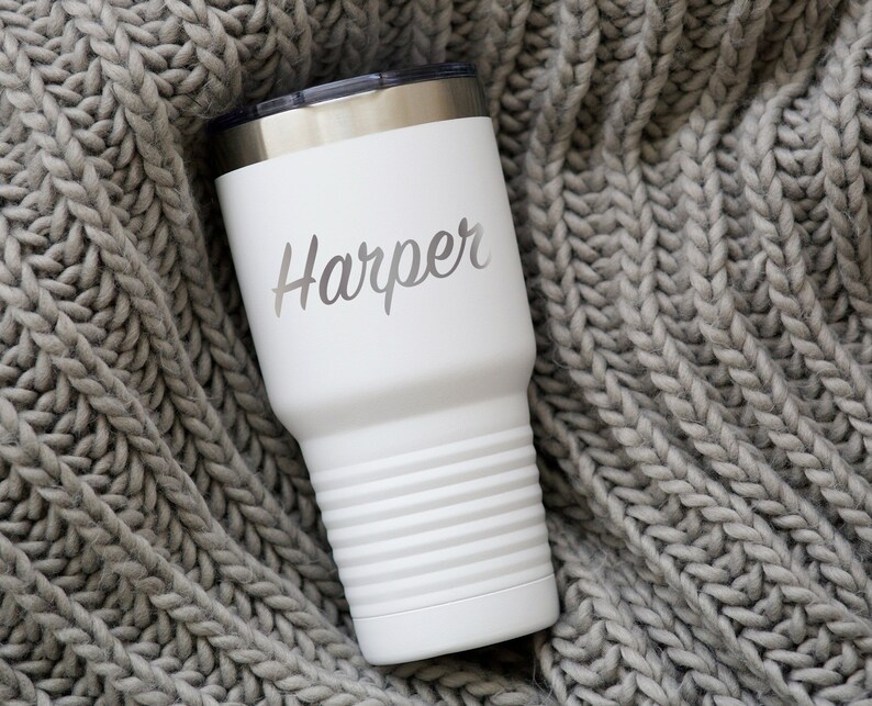 May include: White stainless steel tumbler with a silver lid and the name "Harper" engraved on the side.