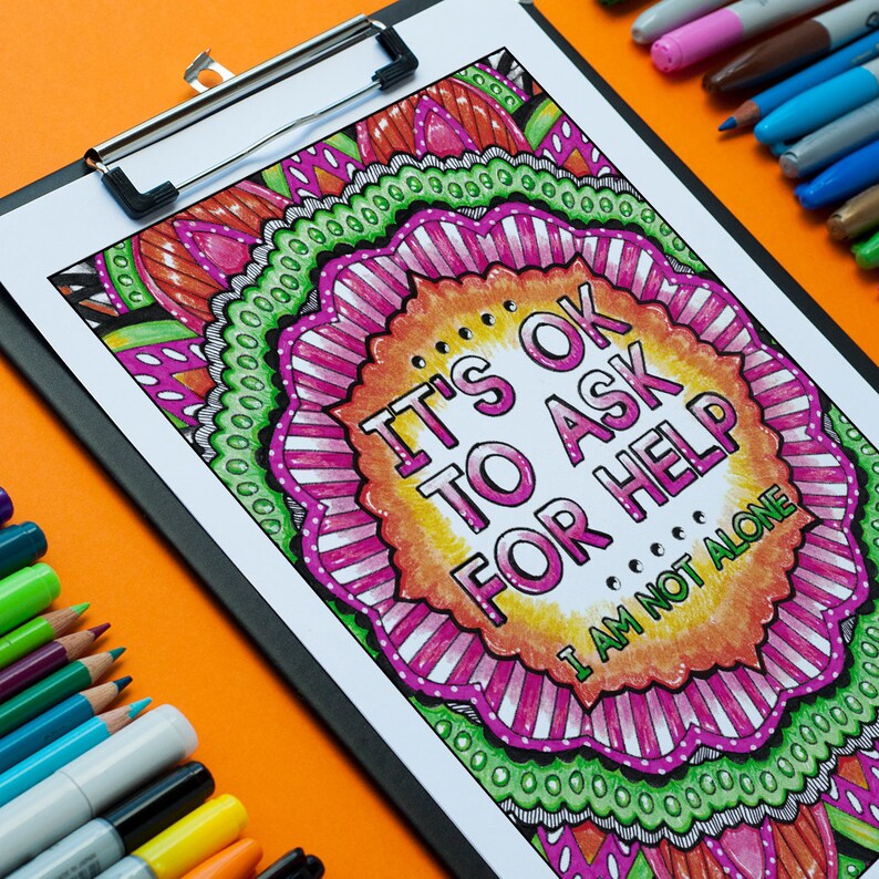 May include: A colourful printable colouring page with a mandala design and the text "It's OK to Ask for Help. I am not alone."