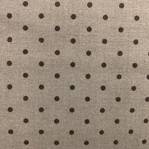 May include: A close-up of a gray fabric with a repeating pattern of black polka dots.