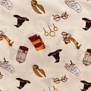 May include: White fabric with a repeating pattern of Harry Potter themed images. The images include owls, glasses, hats, wands, and cages. The fabric is perfect for crafting projects like tote bags, pillows, and quilts.