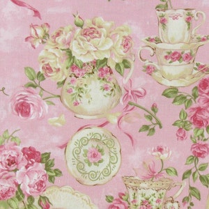 May include: A pink fabric with a repeating pattern of teacups, saucers, and roses. The teacups and saucers are white with gold trim and floral designs. The roses are pink and white.