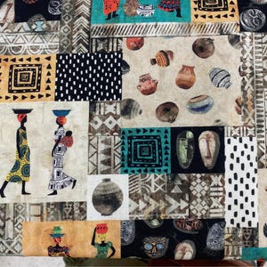 May include: A patchwork textile featuring various African-inspired patterns and illustrations. The design includes geometric shapes, tribal masks, pottery, and figures of people carrying items on their heads. The color palette consists of earthy tones, with accents of black, teal, and yellow.