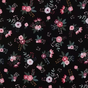 May include: A black background with a repeating pattern of pink and white flowers with green leaves.