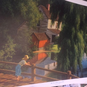 May include: A scenic print depicts a young person in a straw hat and overalls leaning on a wooden bridge, overlooking a calm body of water. A rustic wooden building with a red shed and a weeping willow tree are in the background.