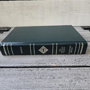 May include: A green hardback book with gold lettering on the spine. The title is "The Harvard Classics Collector's Edition" and the author is "Emerson".