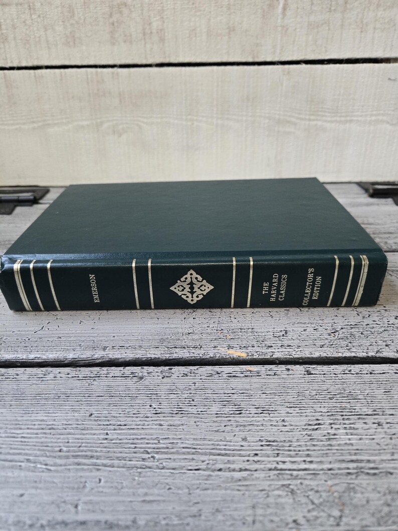 May include: A green hardback book with gold lettering on the spine. The title is "The Harvard Classics Collector's Edition" and the author is "Emerson".