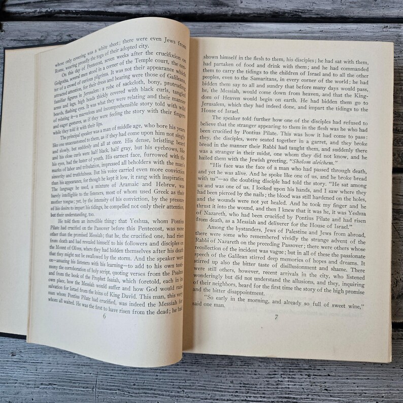 May include: Open book with text on aged paper. The pages are yellowed, and the text is in a serif font. The book is open to a chapter discussing religious figures and events. The book is likely a historical or religious text.