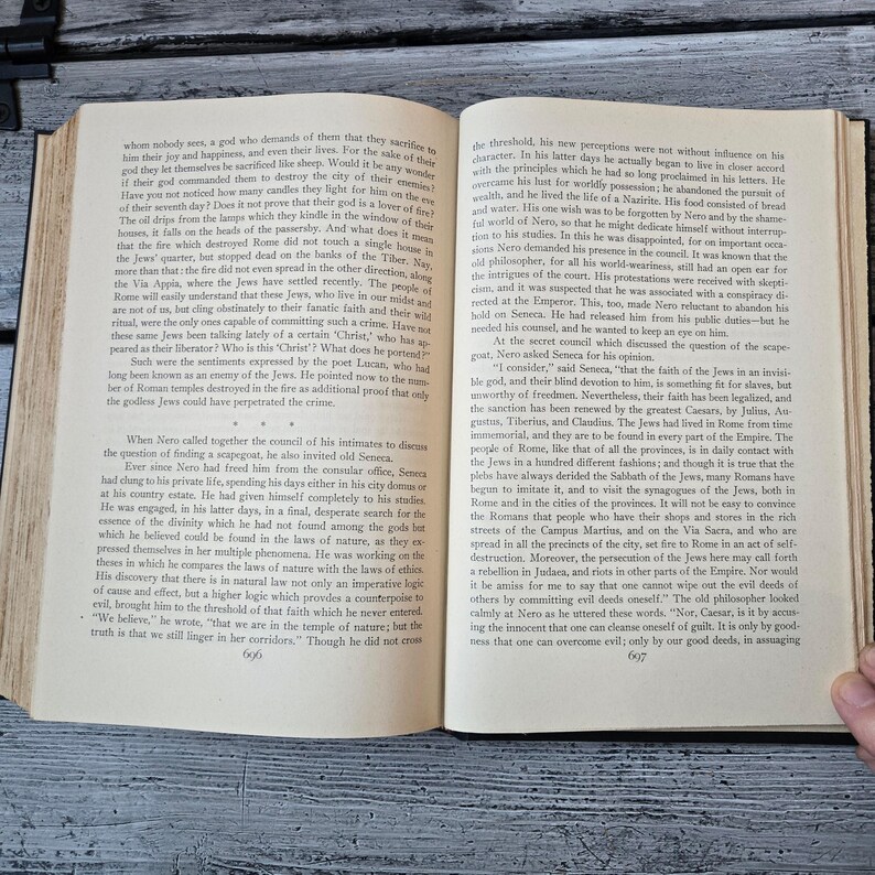May include: An open book with text on aged paper. The pages are yellowed, and the text is in a classic serif font. The book is likely a historical document or a vintage edition. The text is in English. The book is open to page 606.