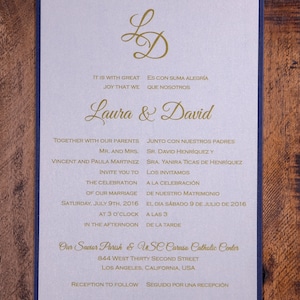 May include: A wedding invitation with a gold and white design. The invitation features the names Laura and David, the date of the wedding, and the location of the ceremony. The invitation also includes the text "It is with great joy that we..." and "Es con suma alegr&iacute;a que nosotros..."