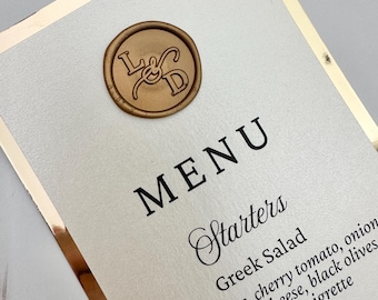 gold foil menu with wax seal, wedding menu and wax seal, gold wax seal on elegant gold foil wedding menu, foil stationery, custom menus