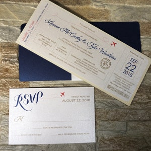 May include: Wedding invitation suite featuring a boarding pass design with the names Leanne & Tyler, date September 22, 2018, and RSVP card. The design includes a navy blue envelope and red airplane graphics.