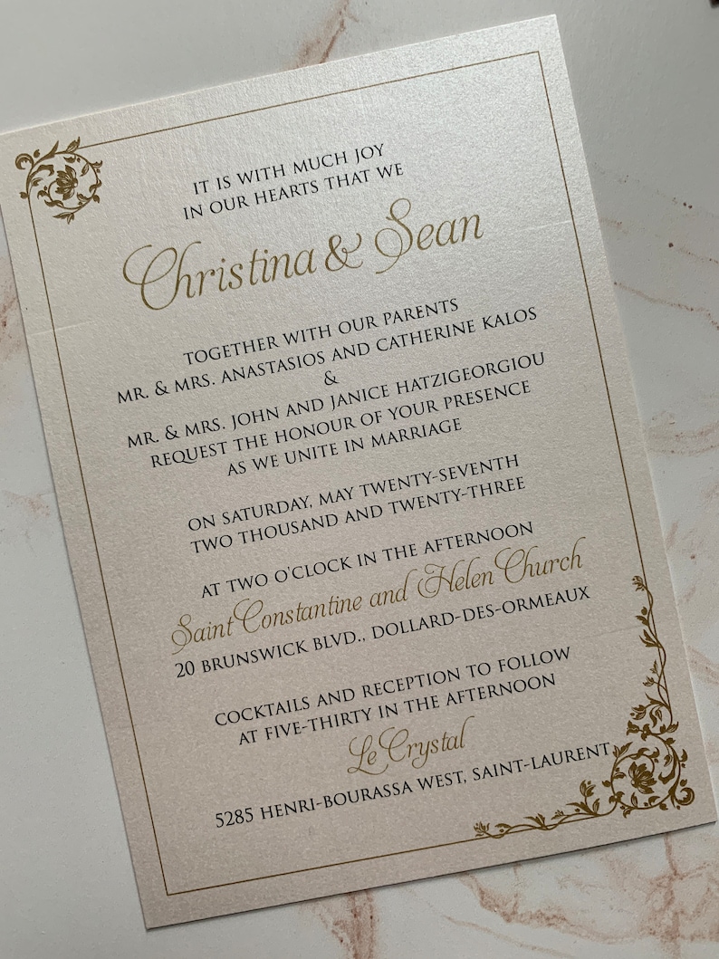 May include: Ivory wedding invitation with gold script. The invitation includes the names "Christina & Sean", event details, and floral corner accents. The text reads "Request the honour of your presence as we unite in marriage."