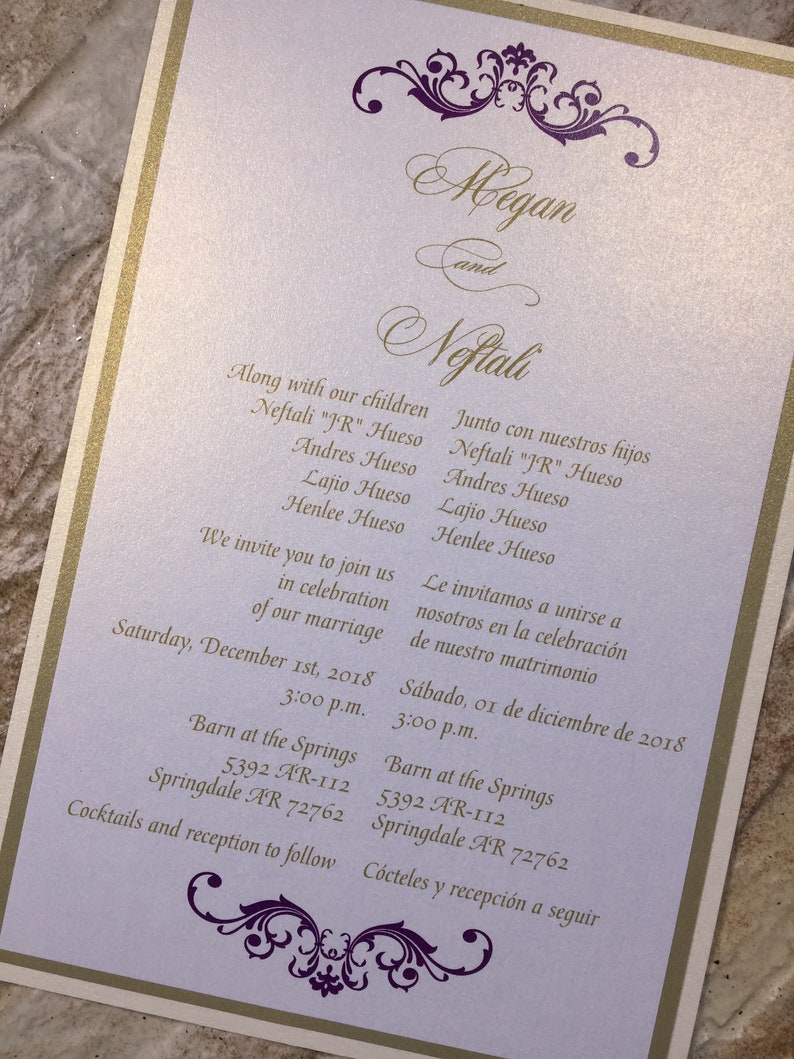 May include: A wedding invitation with a purple and gold design. The invitation is for Megan and Nofiali. The invitation includes the date and time of the wedding, as well as the location. The invitation also includes the names of the couple's children.