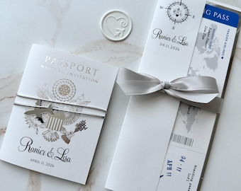blue and white boarding pass wedding invitation and passport, silver and blue passport with acrylic plane, elegant ticket, foil passport