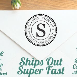 May include: A white envelope with a circular black stamp featuring the letter "S" inside. The stamp reads "STEVENSON, 123 MAIN STREET, PORTLAND, OR 97216." Text on the envelope includes "Love Your Stamp 100% Guaranteed" and "Ships Out Super Fast."
