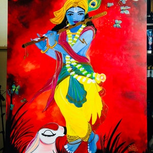 May include: A painting of a blue-skinned Hindu deity playing a flute, with a yellow headdress and a peacock feather. The deity is surrounded by butterflies and a white animal, possibly a dog, is at the deity's feet. The background is a vibrant red.