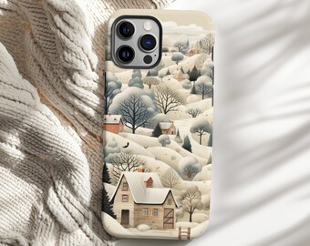 May include: A phone case featuring a winter landscape scene with snow-covered hills, trees, and houses. The design has a watercolor style with soft colors, including beige, white, and touches of red. The case is shown on a white surface next to a cream-colored knitted blanket.