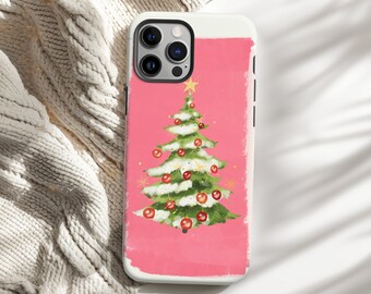 May include: A phone case featuring a watercolor Christmas tree design. The tree is white and green, adorned with red ornaments and a gold star. The background is a solid pink color, with a white border.