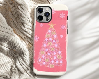 May include: A phone case featuring a pink Christmas tree design. The tree is adorned with gold bows, ornaments, and a star on top. Pink snowflakes are scattered around the tree on a pink background. The case has a white border.