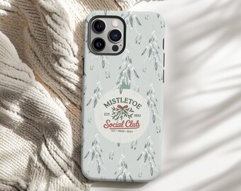 May include: A phone case with a light green background and a repeating pattern of stylized white and green mistletoe branches. The case features a circular logo with the text "Mistletoe Social Club" and the year "1892".