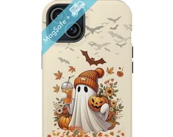 May include: A phone case featuring a cartoon ghost wearing an orange beanie and holding a pumpkin and a drink. The design includes fall leaves, flowers, and bats against a cream background. The case has a MagSafe feature.
