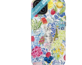 May include: A colorful phone case with a cat, flowers, fruit, and a car. The case has a white background with a blue and white floral pattern. The text "MagSafe+" is printed on the case.